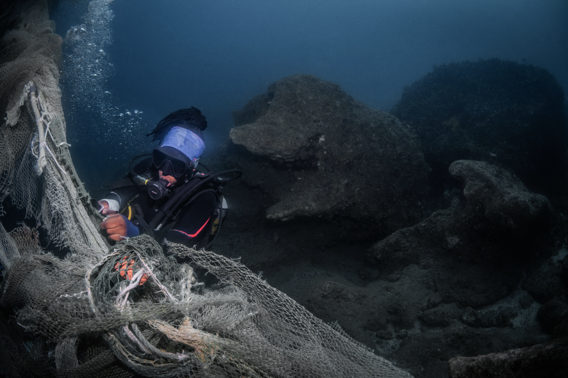 Our team removing industrial ghost nets from the reef